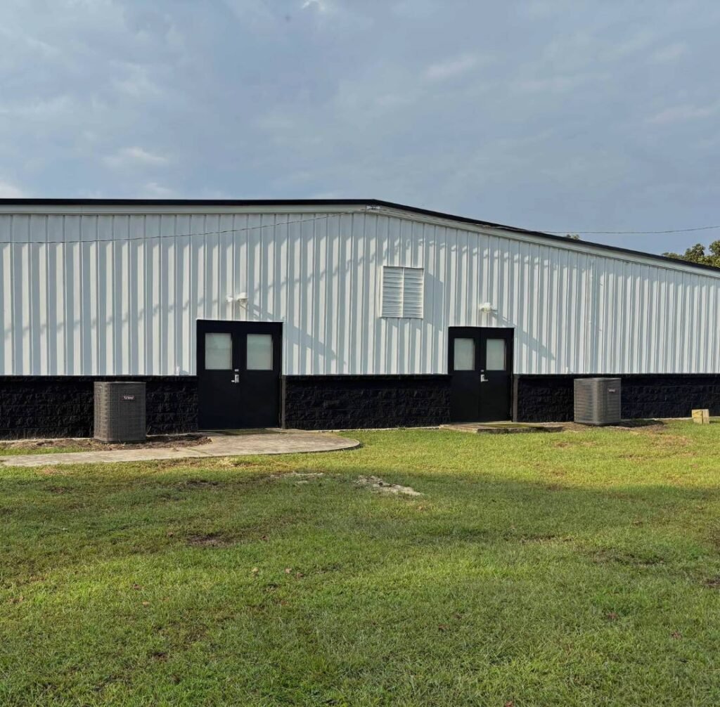 Freshly painted commercial metal building with black and white exterior by JS & EH Contracting in Delaware